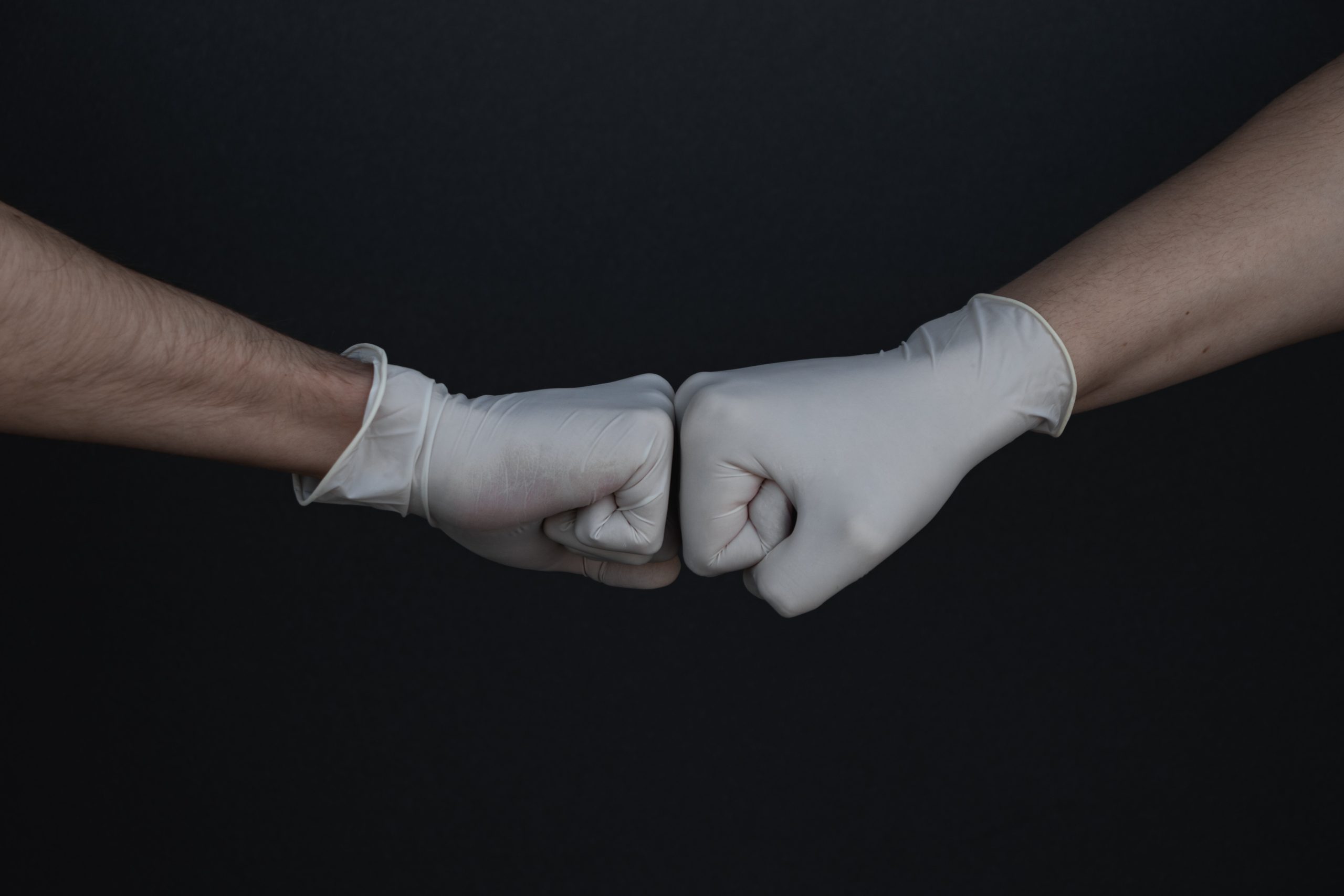 fist-bump with gloves on